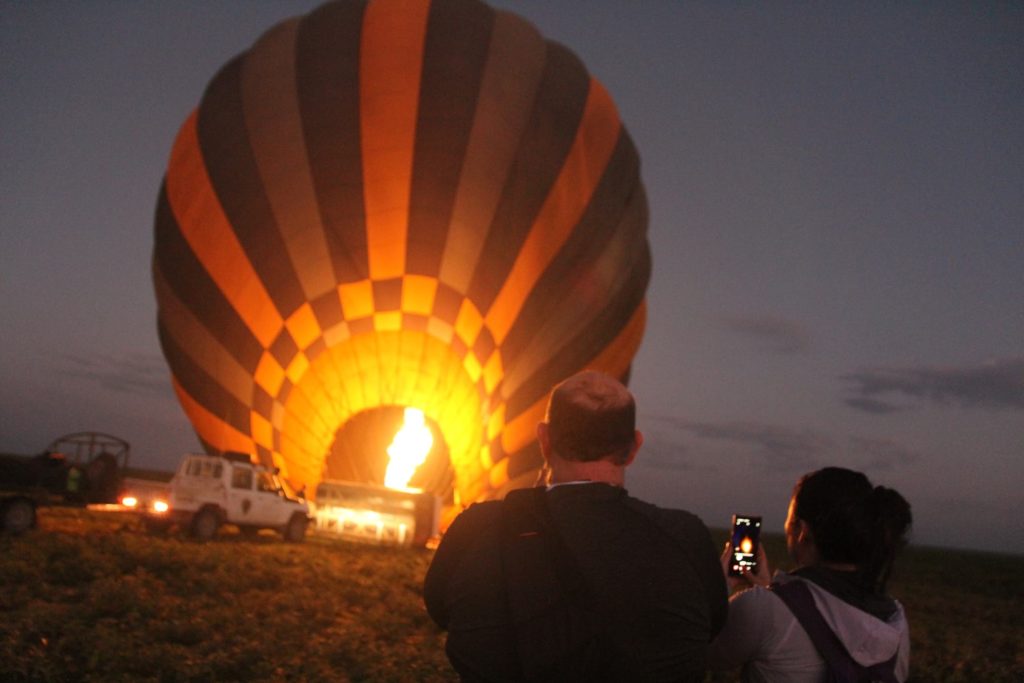 Hot air Balloon Safari in Tanzania being filled in the early morning in preparation for a safari