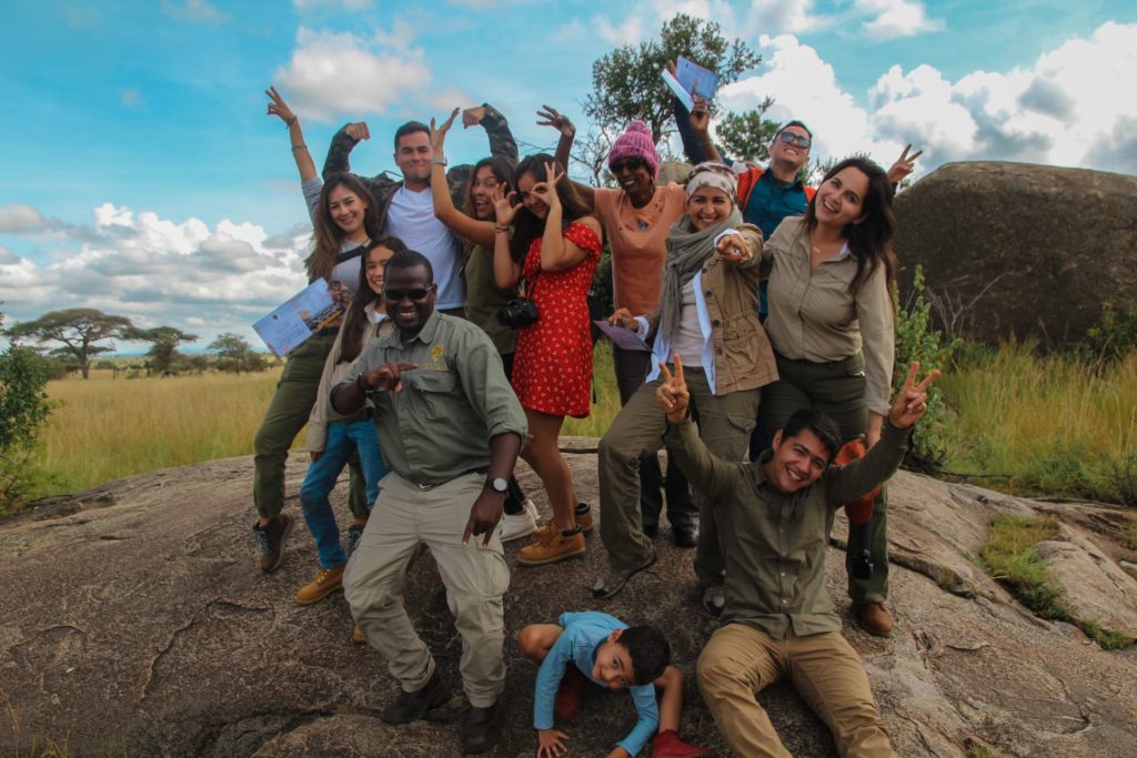 Staff group photo with customer after balloon safari over Serengeti is complete
